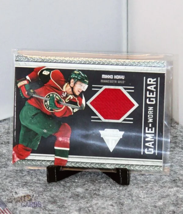 2011-12 Mikko Koivu #46 Panini Titanium Game Worn Gear-stand