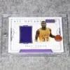 2017-18 Magic Johnson #ADM-7 Panini National Treasures All-Decade 1980s Materials SN#25 - front