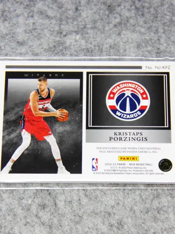 2022-23 Kristaps Porzingis #NJ-KPZ Panini Noir Newsreels Game Used Jerseys SN#45 - back