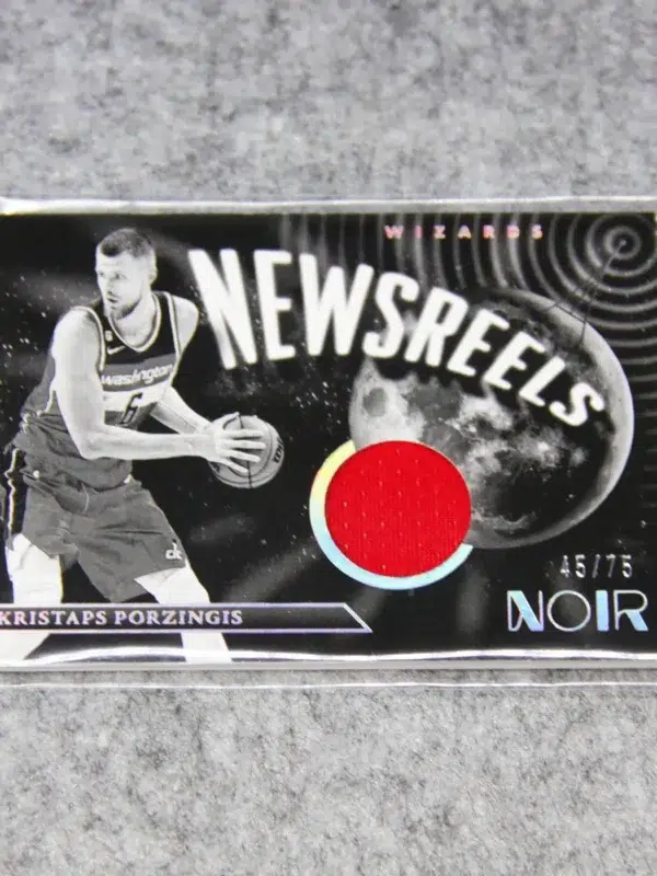 2022-23 Kristaps Porzingis #NJ-KPZ Panini Noir Newsreels Game Used Jerseys SN#45 - front