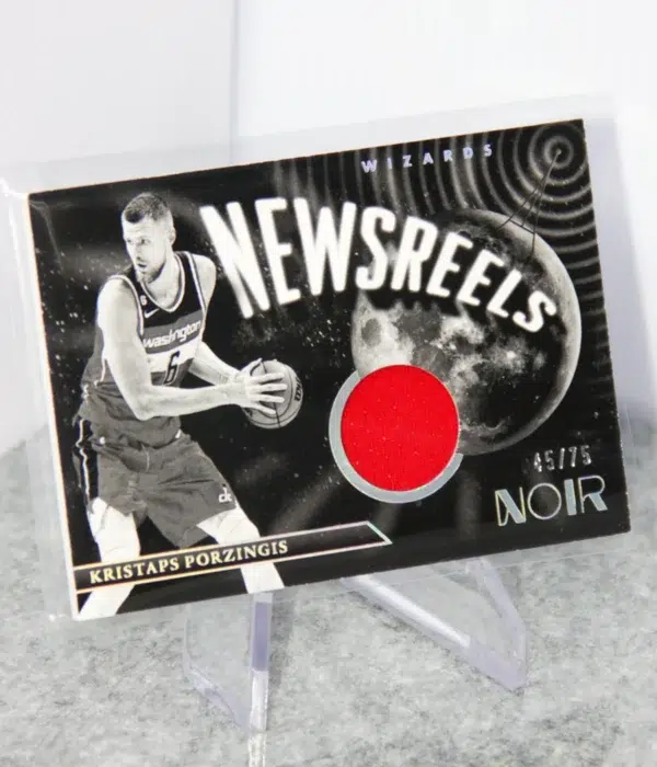 2022-23 Kristaps Porzingis #NJ-KPZ Panini Noir Newsreels Game Used Jerseys SN#45 - stand