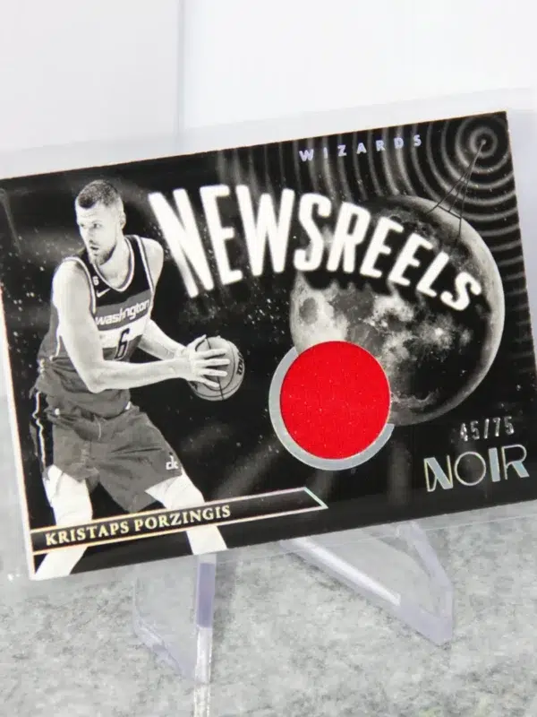 2022-23 Kristaps Porzingis #NJ-KPZ Panini Noir Newsreels Game Used Jerseys SN#45 - stand