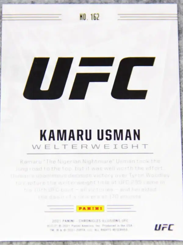 2021 Kamaru Usman #162 Panini UFC Chronicles Illusions Red Parallel SN#124 - back
