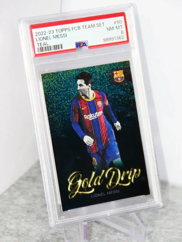 2022-23 Lionel Messi #50 Topps FC Barcelona Team Set Teal Gold Drips SN#131 PSA 8 NM-MT - stand