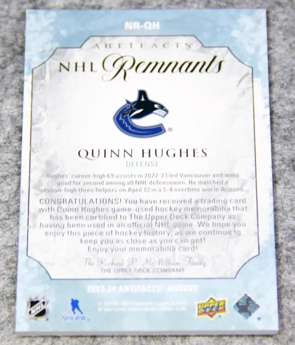 2023-24 Quinn Hughes #NR-QH Upper Deck Artifacts NHL Remnants Jersey Patch - back