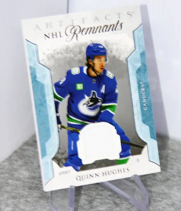 2023-24 Quinn Hughes #NR-QH Upper Deck Artifacts NHL Remnants Jersey Patch - stand