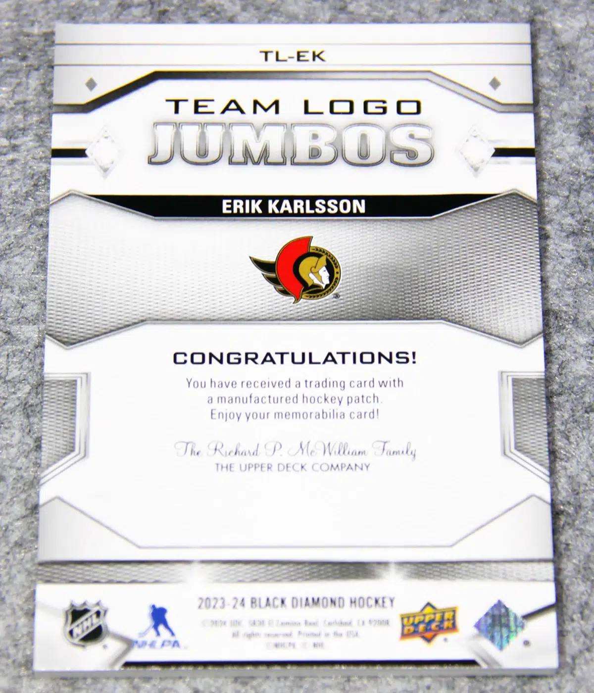 2023-24 Erik Karlsson #TL-EK Upper Deck Black Diamond Team Logo Jumbos Patch
