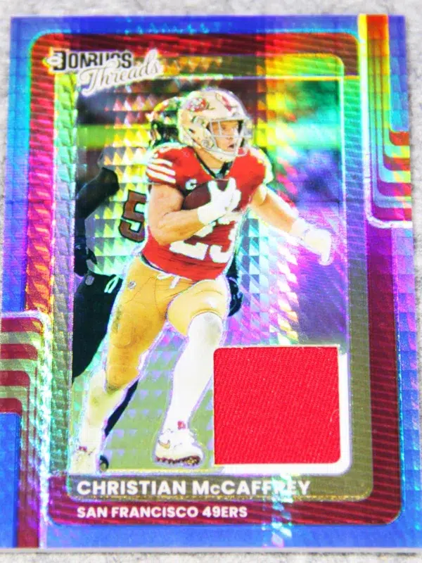 2025 Christian McCaffrey #DTBH CMY Panini Donruss Optic Donruss Threads Blue Hyper - front