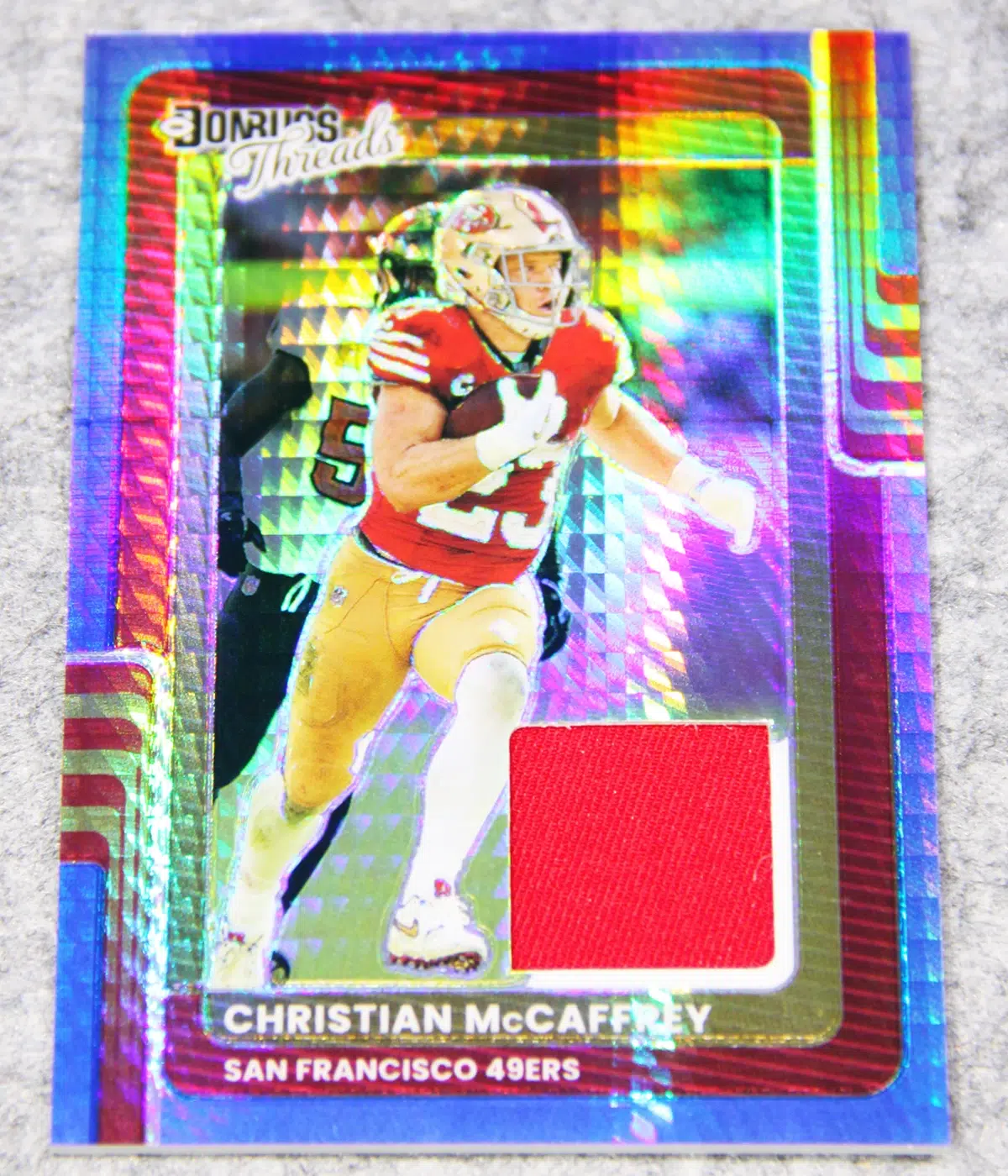 2025 Christian McCaffrey #DTBH CMY Panini Donruss Optic Donruss Threads Blue Hyper - front