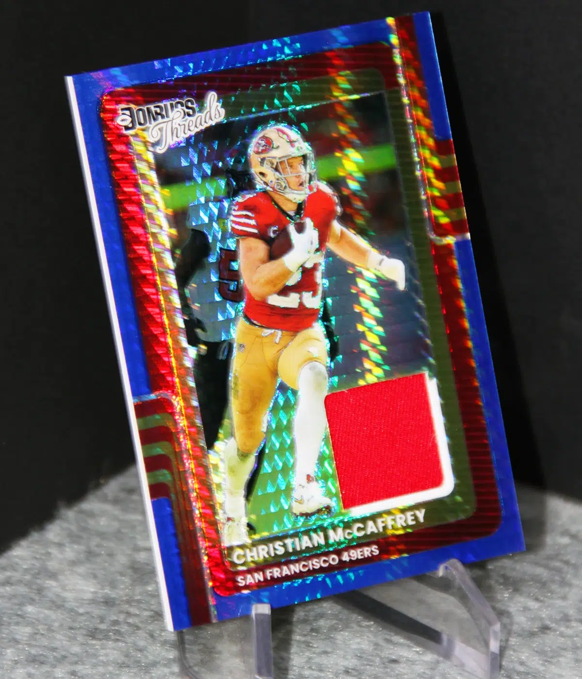 2025 Christian McCaffrey #DTBH CMY Panini Donruss Optic Donruss Threads Blue Hyper - stand